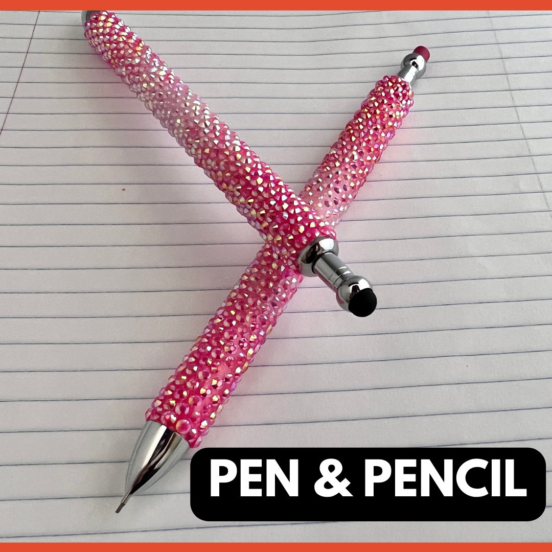 A pink ombre rhinestone pen and pencil set lying flat on lined paper. The words "PEN & PENCIL" in bold.
