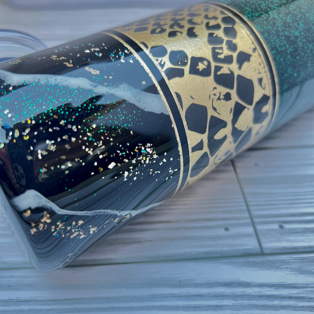 Bottom half of the tumbler, showing a closer look at the snake skin design and the green and gold mix of glitters.