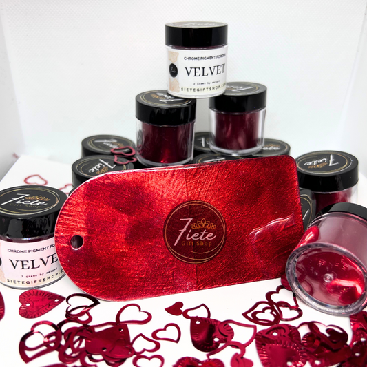 Chrome pigment powder labeled 'VELVET' by Siete Gift Shop, several closed bottles, and a central, glossy color swatch surrounded by small, red, heart-shaped glitter decorations.